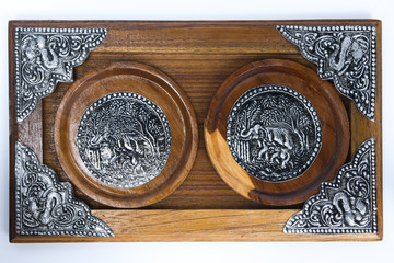 Elephant wooden coasters (Thai style), made from metal material and wood.