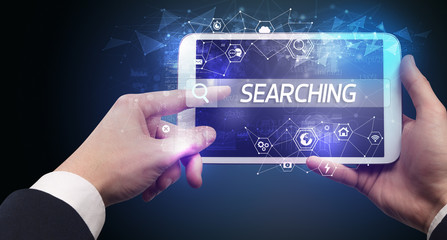Close-up of a tablet searching INTERNET inscription, hi-tech computing concept