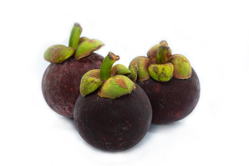 Mangosteen (Garcinia mangostana) is an exotic, tropical fruit with a slightly sweet and sour flavor, isolated on white background.