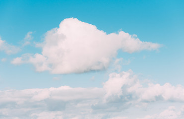 Obraz premium white clouds in a blue sky. Bright day, horizontal photography