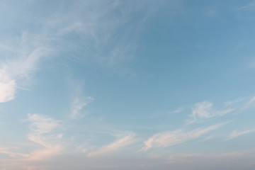 Sunset cloudy blue sky with the orange sun