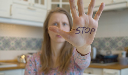 Woman with stop sign on the hand