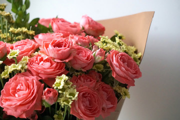 a piece of a lush bouquet of pink roses