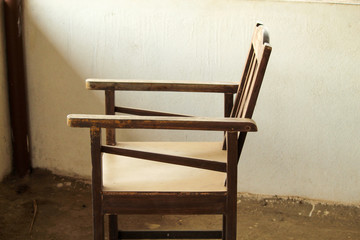 side view of an old wooden chair.