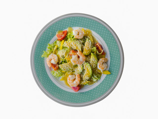 Isolated green salad with shrimp and avocado on a plate