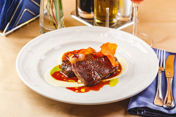 Beef tenderloin medallions with sauce and onion