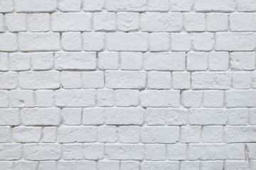 Old brick wall painted in white color