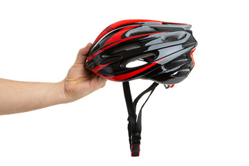 hand holding a CYCLING HELMET from the front. ISOLATED WHITE BACKGROUND