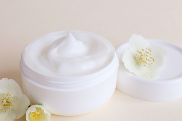 Fototapeta na wymiar Cream moisturizer in the white jar. The concept of health and beauty.
