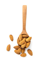 Dry Almonds in a brown wooden spoon isolated on white background. Top view and clipping path.