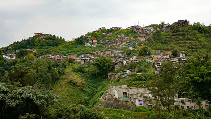 Houses built on the hill of the mountain; suburbs in Colombia
