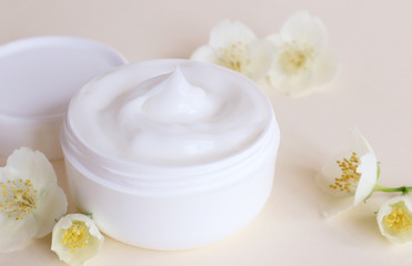 Cream moisturizer in the white jar. The concept of health and beauty.