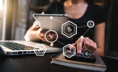 Businesswoman hand working digital marketing media in virtual screen with mobile phone and modern...
