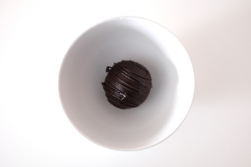 Chocolate cake in a cup on a white table