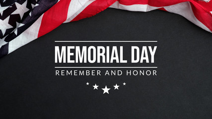 Fototapeta na wymiar Memorial Day background. Remember and honor with waving USA flag on dark background