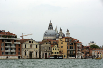 Naklejka premium Cityscape with Santa Maria della Salute church with historical facades and adriatic sea in Venice. View from the adriatic sea