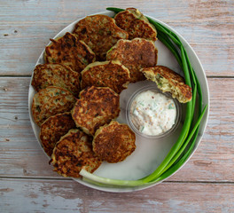 Potato pancakes with green onion and sauce