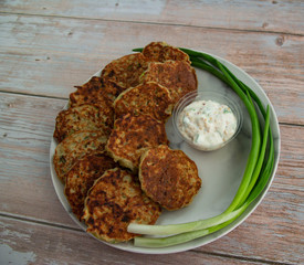 Potato pancakes with green onion and sauce