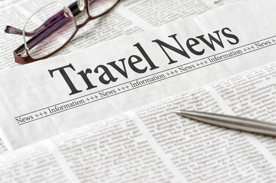A newspaper with the headline Travel News