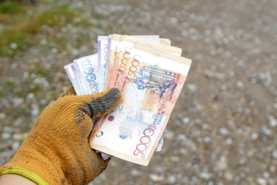 Money in the hands of a working man, received a salary.