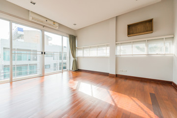 Empty room with whitewashed floating laminate flooring
