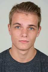 Obraz premium Face of young handsome man with blond hair