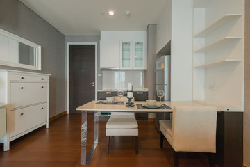 Stylish kitchen interior with dining table and chairs