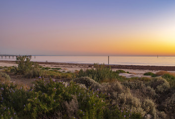 Sdown ununset on the beach, Glenelg Beach in South Australia