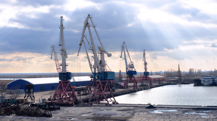 shipyard with cranes at sea as a logistics center for the distribution of goods on land and water