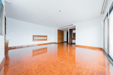 Empty room with big window in loft style. Wooden floor