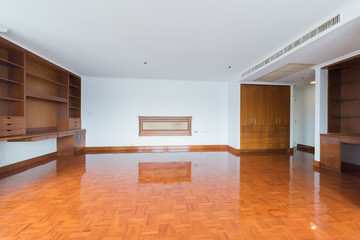 Empty room with big window in loft style. Wooden floor