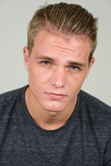 Obraz premium Face of young handsome man with blond hair