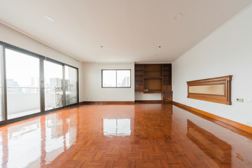 Fototapeta na wymiar Empty room with big window in loft style. Wooden floor