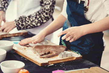 Close up of cookies baking. Little kids hands