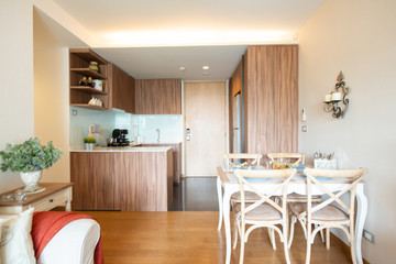 Stylish kitchen interior with dining table and chairs