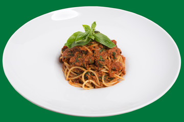 Spaghetti bolognese on a white plate.
