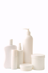 Different cosmetic bottles isolated on white background