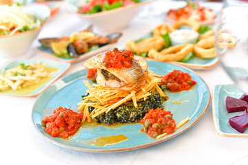 appetizers with yogurt, tomatoes, cheese, lemon, greens, mussels, olives, snacks on white background, ready for service, should be used as background.