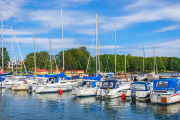 Fototapeta na wymiar Boats in the harbor at the swedish city of Hjo