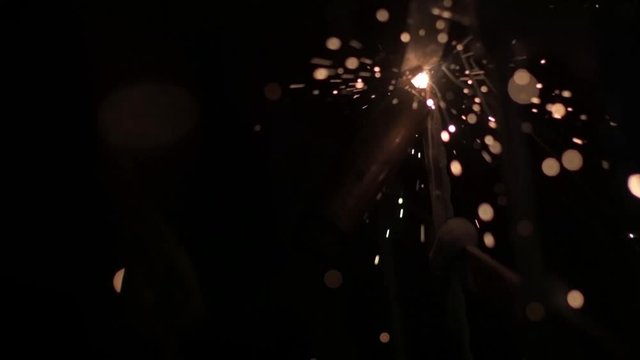 fireworks in the night sky. Welding work on metal close-up. Sparks and light from high temperature