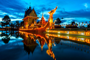 Fototapeta na wymiar A huge Thai Suphannahong, also called Golden Swan or Phoenix boat at the WatpahSuphannahong Temple twilight time in sisaket, Thailand.