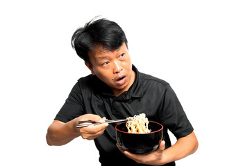Asian man eating noodles on white background