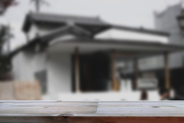 Fototapeta na wymiar Wood Table Top in Blur Background with empty copy space