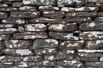 Weathered dry stone wall background