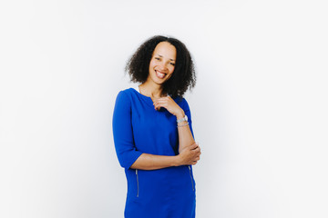 portrait of cheerful black woman in blue dress