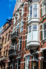 Obraz premium Old classic houses in Amsterdam, Netherlands