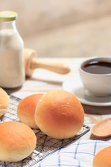 Breakfast, bread and coffee on a wooden table