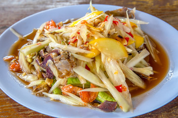 Papaya salad or SOM TAM or Somtum with crab. Famous Thai food.