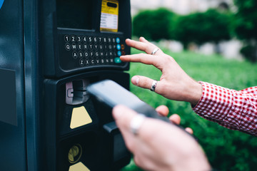 Obraz premium Anonymous person making withdrawal from ATM