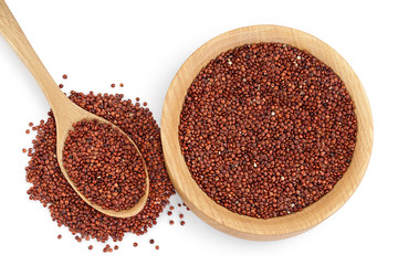 red quinoa seeds in wooden bowl and spoon isolated on white background with clipping path and full depth of field. Top view. Flat lay